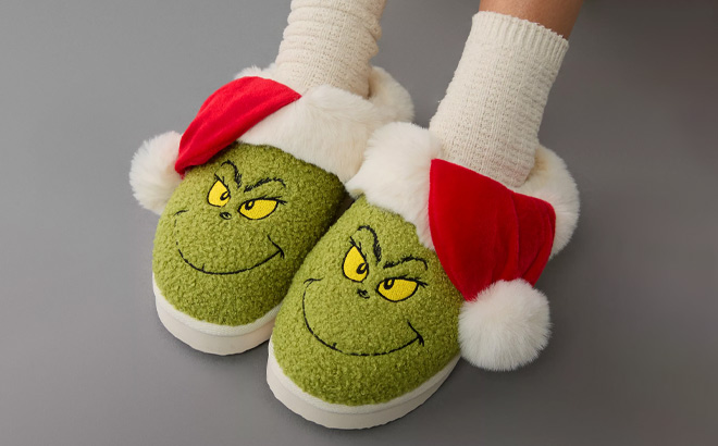 A Person Wearing AE Grinch Scuff Slippers