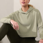 A Person Wearing Athleta Presence Hoodie in Moss Color