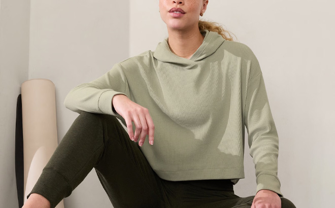 A Person Wearing Athleta Presence Hoodie in Moss Color