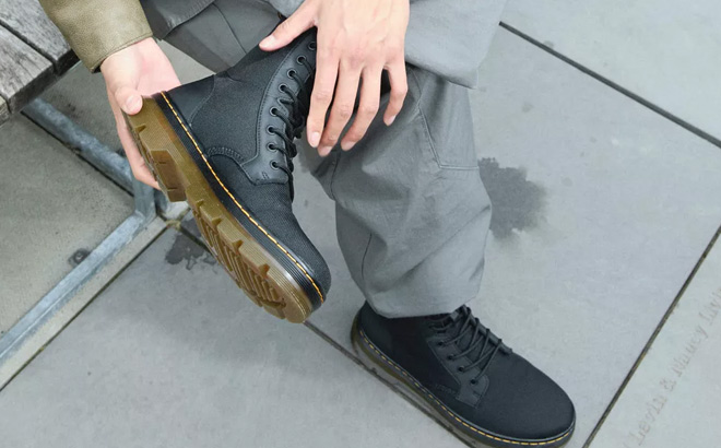 A Person Wearing Dr Martens Combs Poly Casual Boots