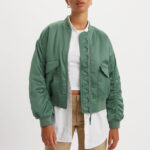 A Person Wearing Levis Andy Techy Jacket in Dark Forest Green Color