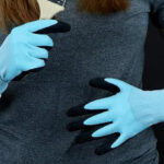 A Person Wearing Miracle Gro Water Resistant Grip Gloves