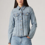 A Person is Wearing Levis Slim Tailored Trucker Jacket in Medium Wash