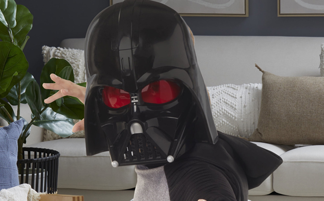 A Person wearing Star Wars Darth Vader Electronic Mask