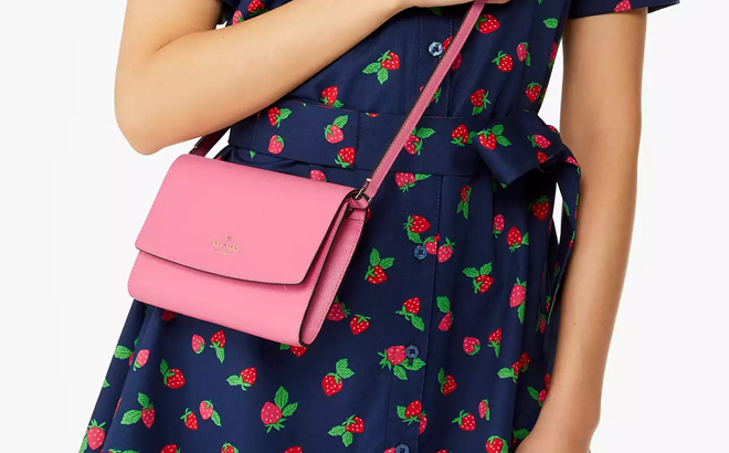 A Person wearing a Kate Spade Perry Leather Crossbody Bag