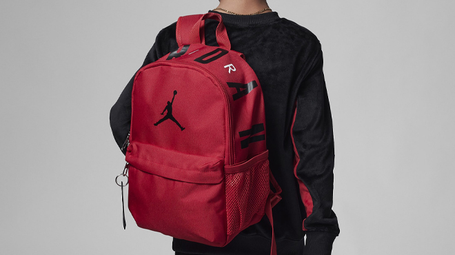 A Person wearing a Nike Air Jordan Mini Backpack