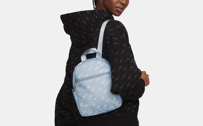 A Person wearing a Nike Sportswear Futura 365 Mini Backpack