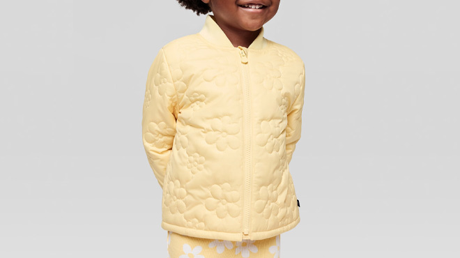 A Toddler Girl Wearing GAP Factory Quilted Jacket