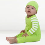 A Toddler Wearing The Grinch Christmas Baby Green Coverall and Hat