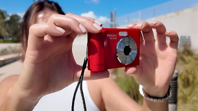 A Woman Taking Pictures with the Vivitar 16MP Digital Zoom Point Shoot Camera