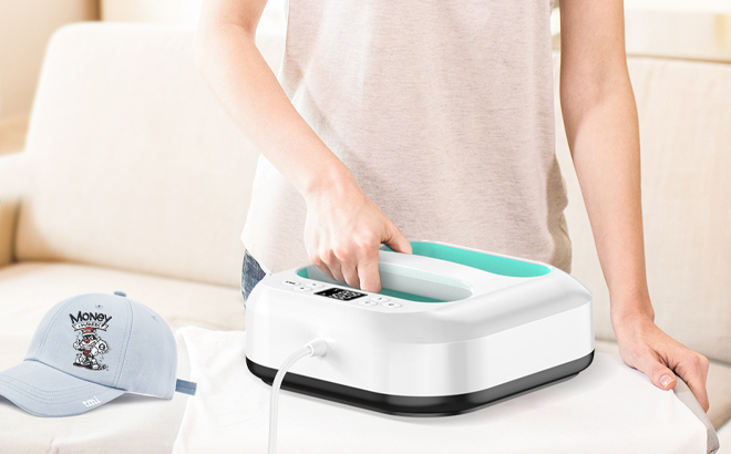 A Woman Using the Lolssa Heat Press Machine