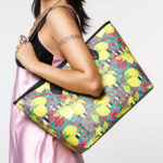 A Woman Wearing Betsey Johnson Fresh n Fruity Tote with Necklace