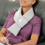 A Woman Wearing a Sharper Image Calming Heat Neck Wrap