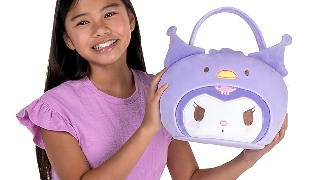 A girl holding a Hello Kitty Kuromi 12 Inch Plush Pail