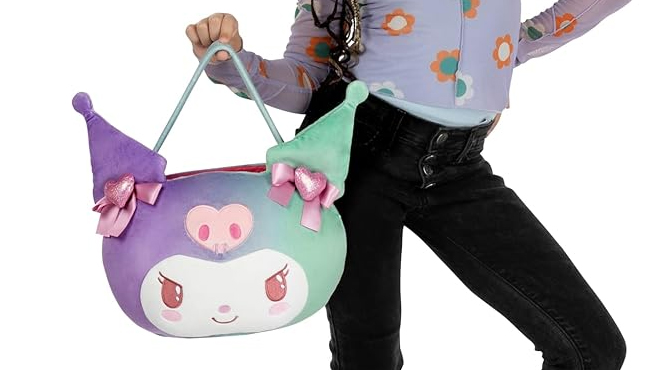 A girl holding a Hello Kitty Kuromi Valentine 12 inch Plush Pail