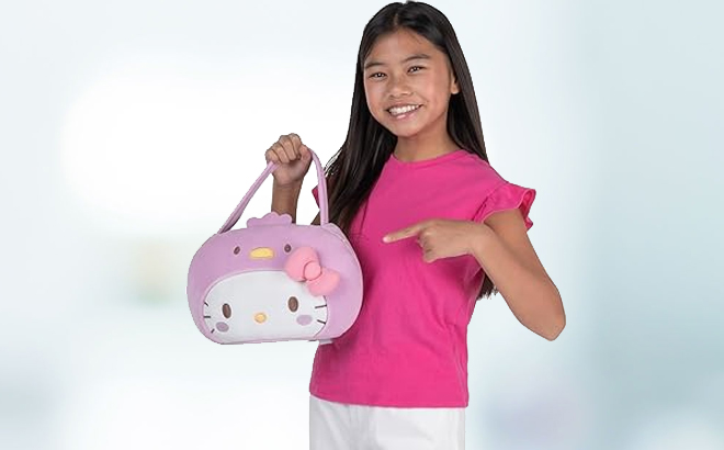 A girl holding a Hello Kitty Plush Pail