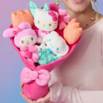 A lady holding Hello Kitty 12 inch Plush Valentines Bouquet