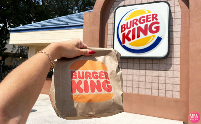 A person holding a bag from Burger King