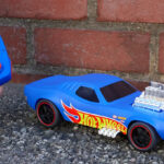 A person playing with Hot Wheels Rodger Dodger RC Toy Car