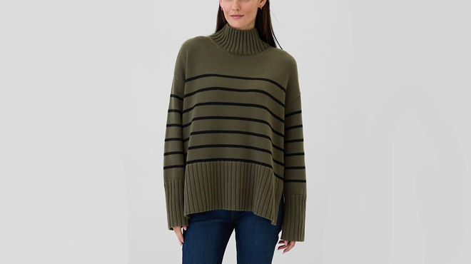 A person wearing a GAP Oversized Split Hem Mockneck Sweater