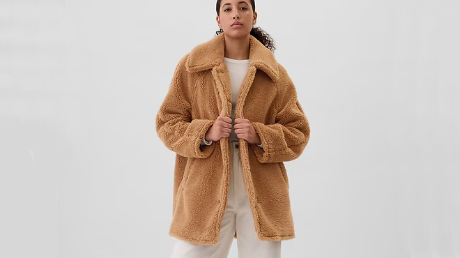 A person wearing a GAP Womens Sherpa Coat