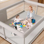 An Adult and Two Babies in a Hiaksedt Baby Playpen