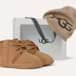 Baby Neumel UGG Beanie on a Cream Color Background