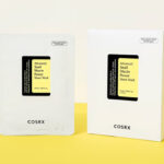 COSRX Snail Mucin Sheet Mask 10 EA with Snail Mucin Serum on the Yellow Table