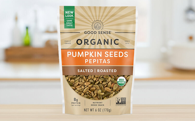 Good Sense 6 Ounce Roasted Salted Organic Pumpkin Seeds Bag on a Table