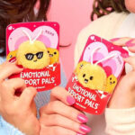 Hands holding Emotional Support Valentines Day Plush Nuggets