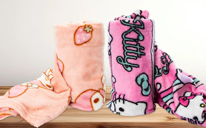 Hello Kitty and Friends Silk Touch Throw Blankets on a Table