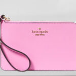 Kate Spade Lucy Small L Zip Wristlet on a Table