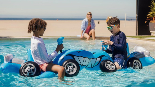 Kids Playing in a Hot Wheels Funboy Kids Pool Float with Water Squirter