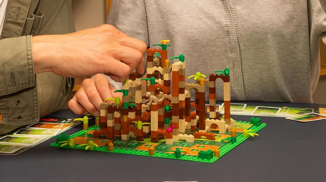 People Playing LEGO Monkey Palace Board Game