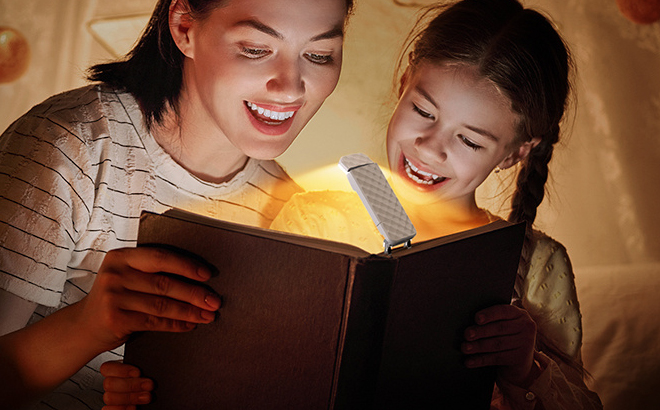 People reading a Book with Opaul Clip On Book Light on it