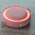 Pop Sonic White Noise Sound Machine with Bluetooth Speaker on the Table