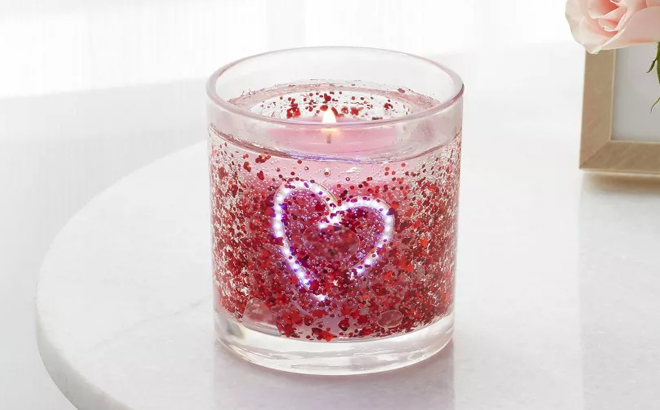 Room Essentials Sugared Watermelon Light Up Gel Candle on a Table