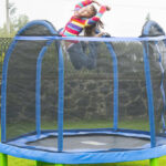 a Kid Playing in the Trampoline