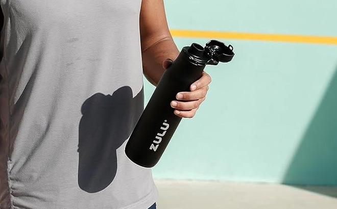 a Person Holding Zulu Ace Vacuum Insulated Stainless Steel Water Bottle with Chug Spout