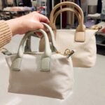 A Person Holding Universal Thread Foundational Mini Tote Handbags