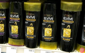 LOreal Paris Elvive Total Repair 5 Conditioner and Shampoo on a Shelf