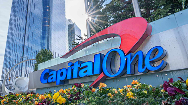 Capital One Sign with a Building in the Background