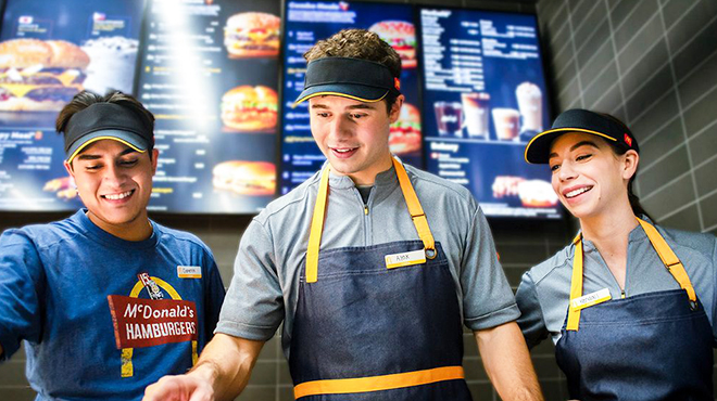 Three Smiling McDonalds Employees at Work