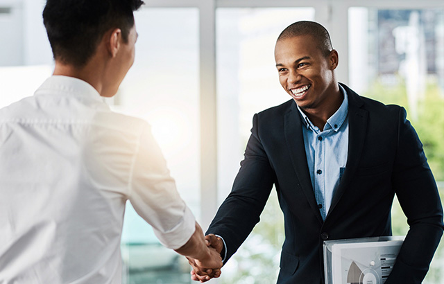 Two People Shaking Hands