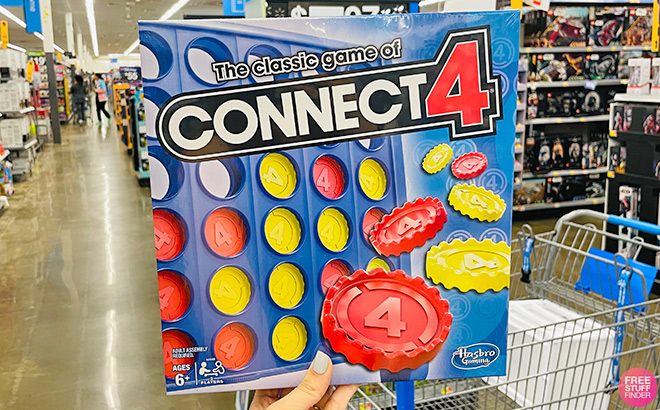 A Hand Holding Connect 4 Board Game