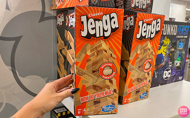 A Hand Holding a Jenga Box