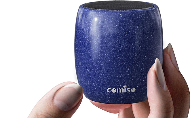 A Hand Holding a Portable Bluetooth Speaker