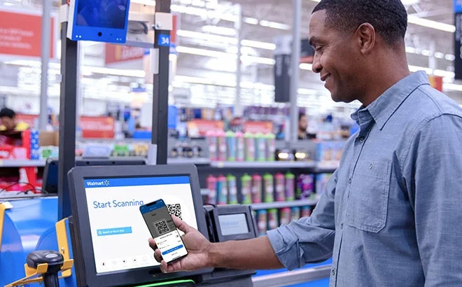 A Man Scanning his Walmart App in Store